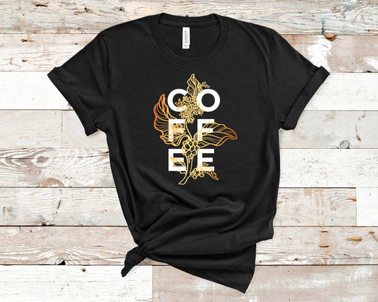 The design on this T-shirt features a beautiful coffee plant line art overlapping with the word COFFEE.